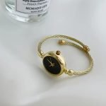 Elegant Women’s Quartz Bracelet Watch – Golden-Tone Alloy Bangle with Black Dial, Chic Jewelry Gift